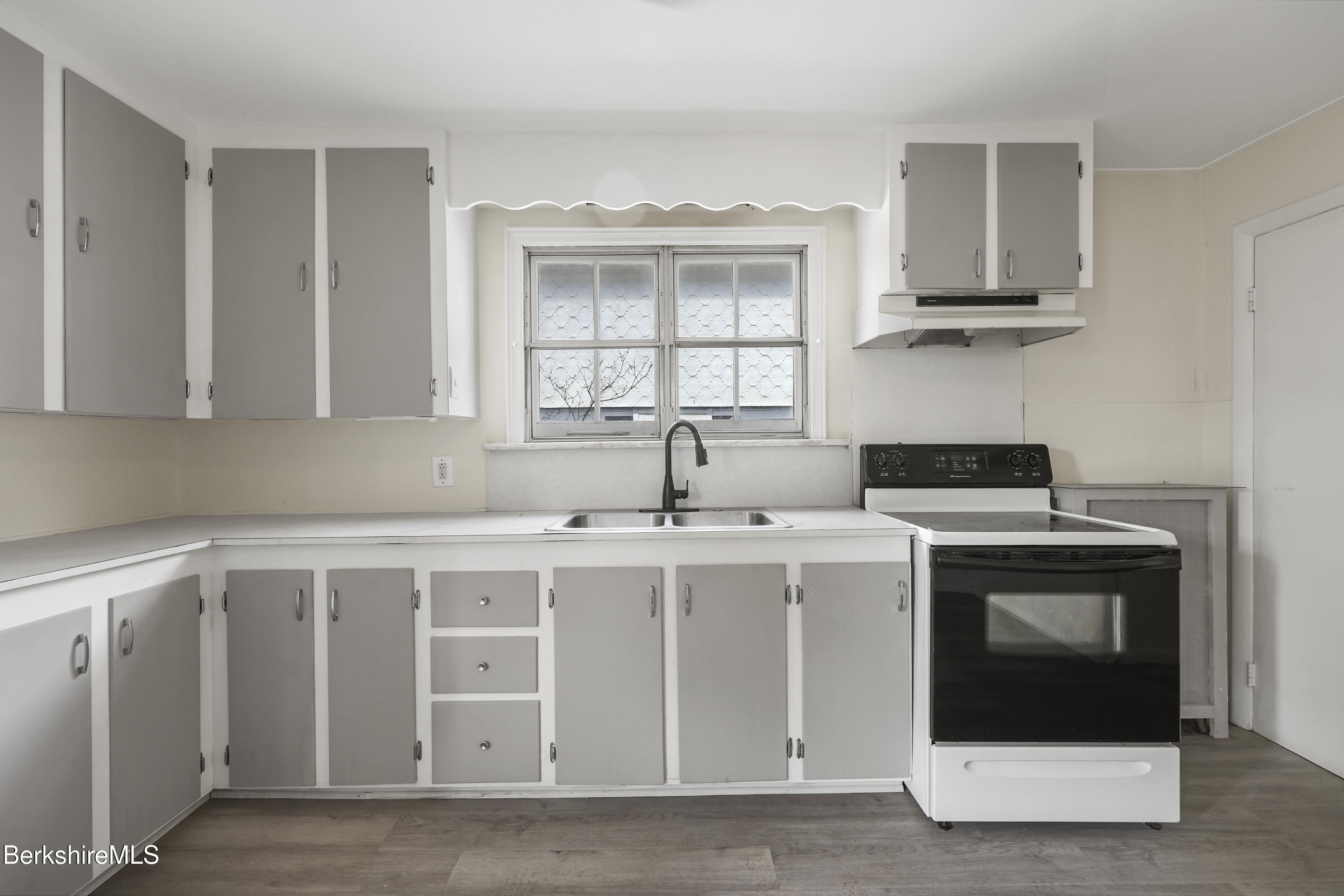49 McArthur Street Pittsfield, MA 01201 - Photo 14 of 33 a kitchen with a stove and a sink