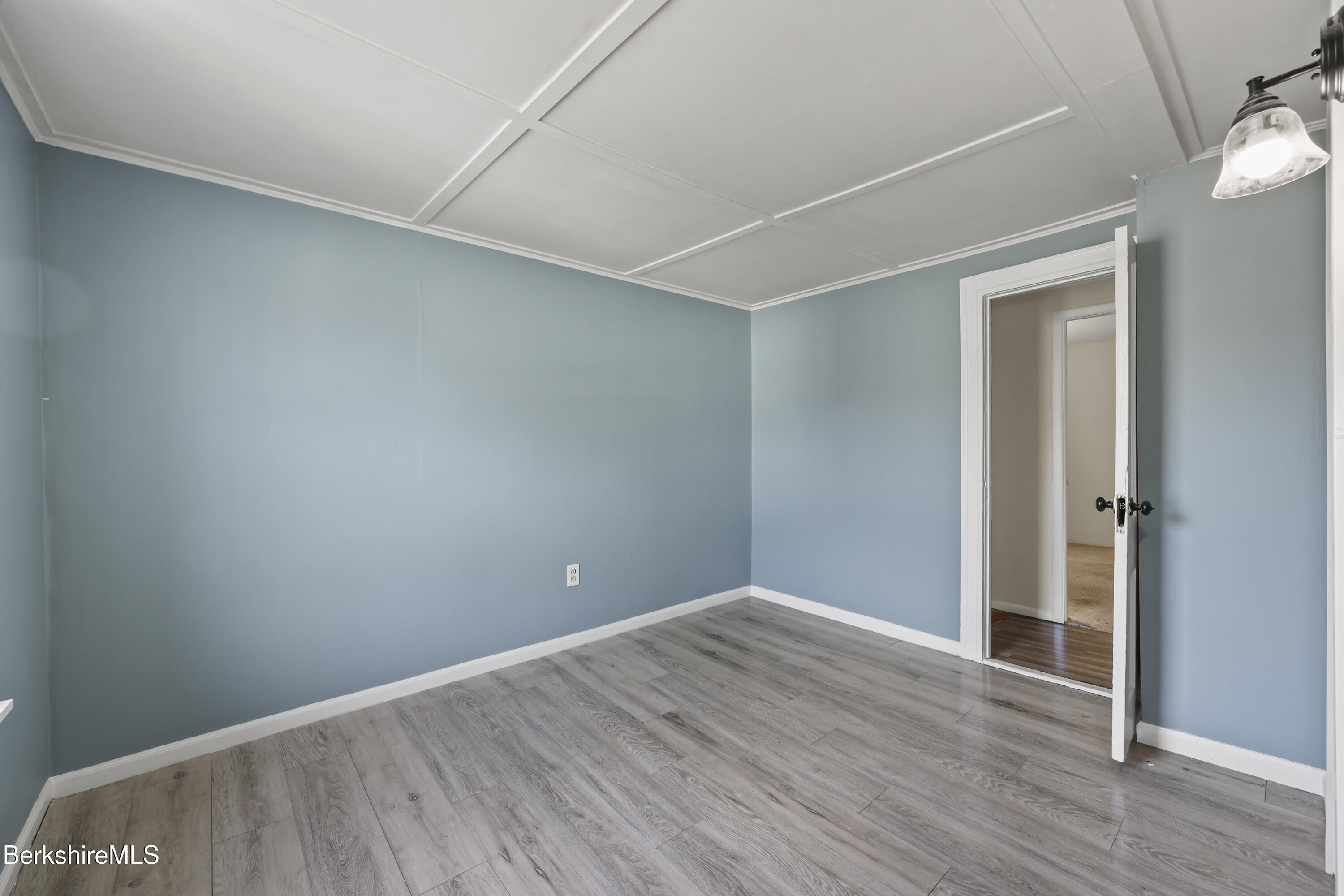 49 McArthur Street Pittsfield, MA 01201 - Photo 19 of 33 a view of an empty room with wooden floor