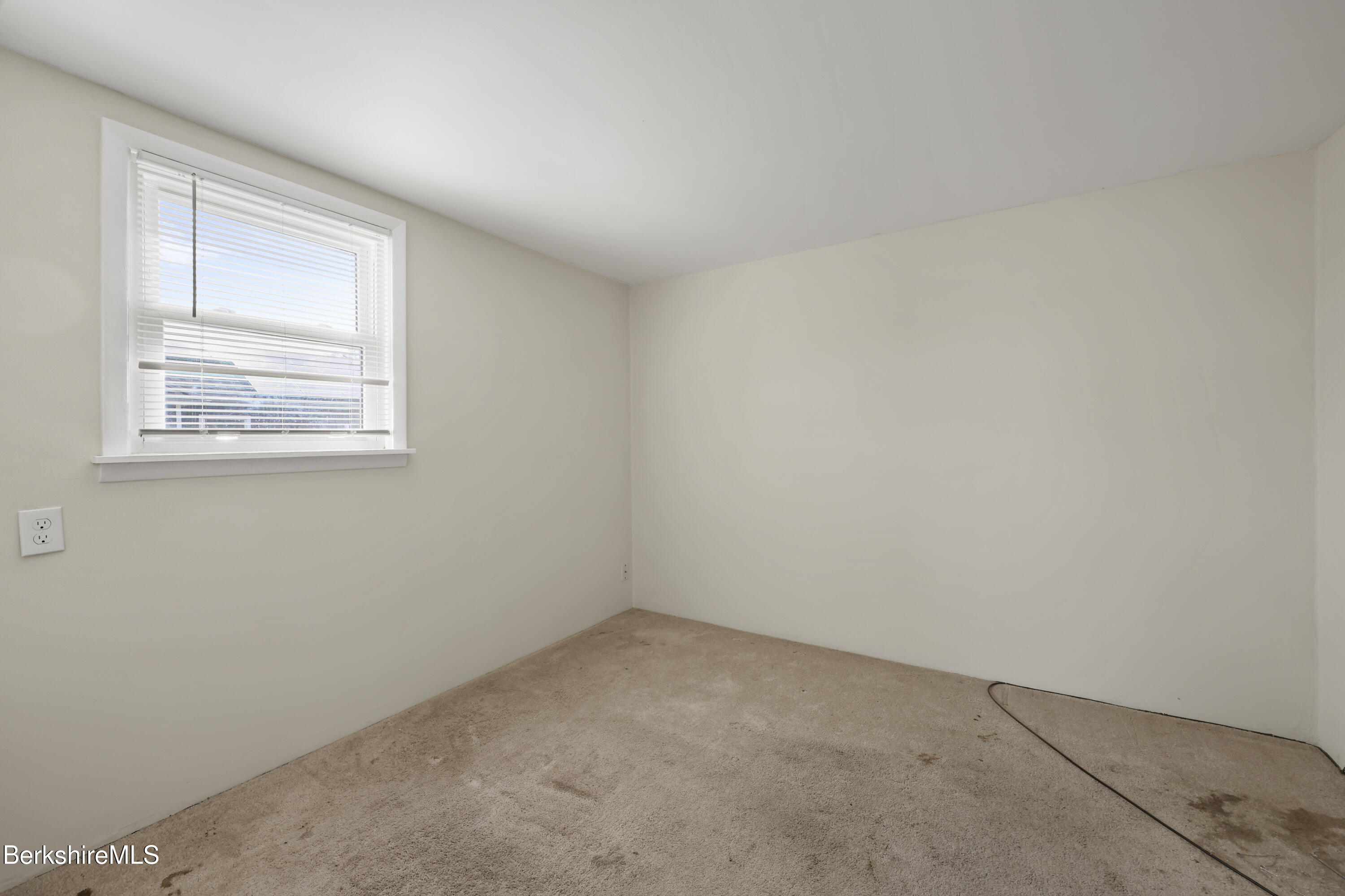 49 McArthur Street Pittsfield, MA 01201 - Photo 23 of 33 an empty room with a window