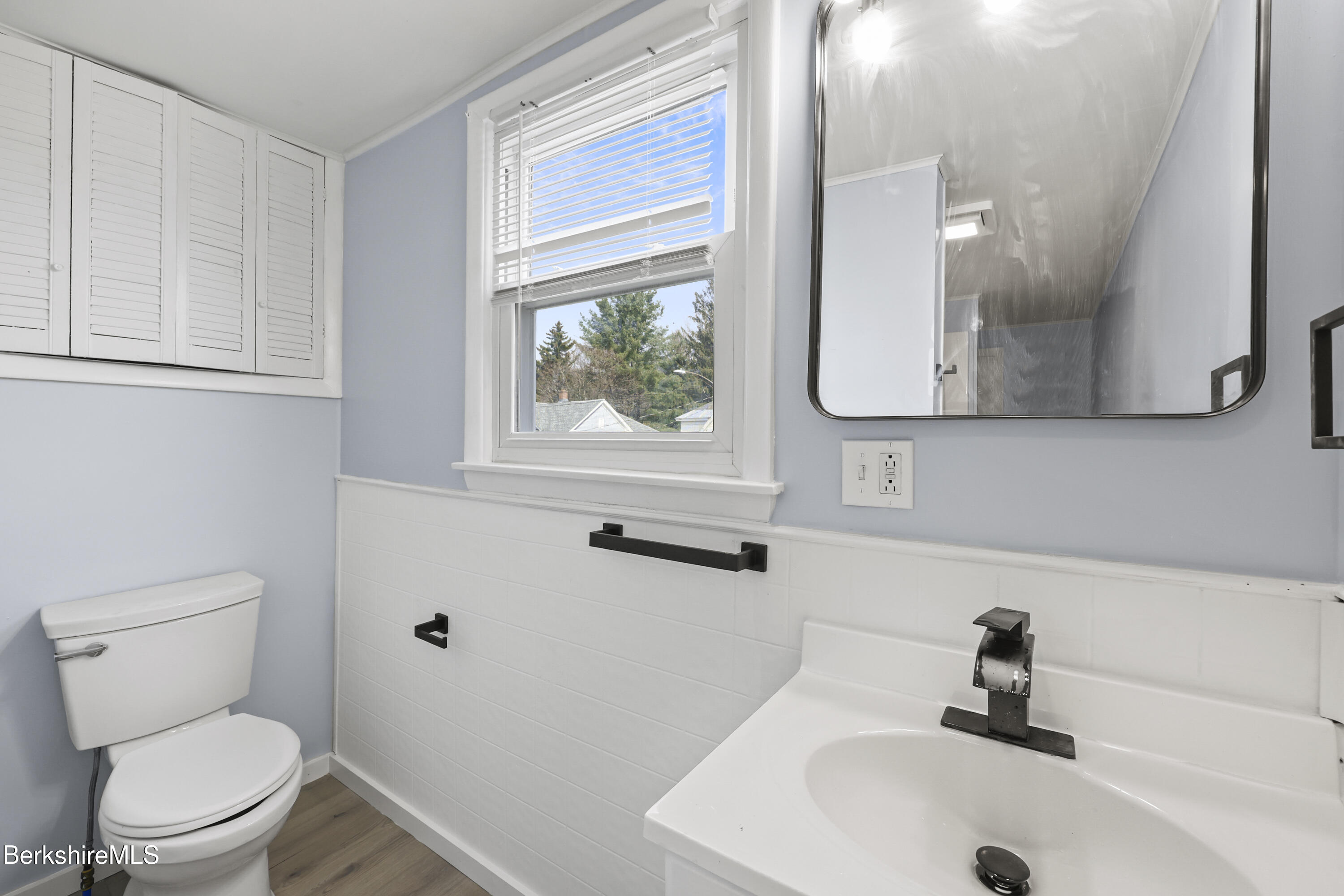 49 McArthur Street Pittsfield, MA 01201 - Photo 25 of 33 a bathroom with a sink a toilet and a mirror