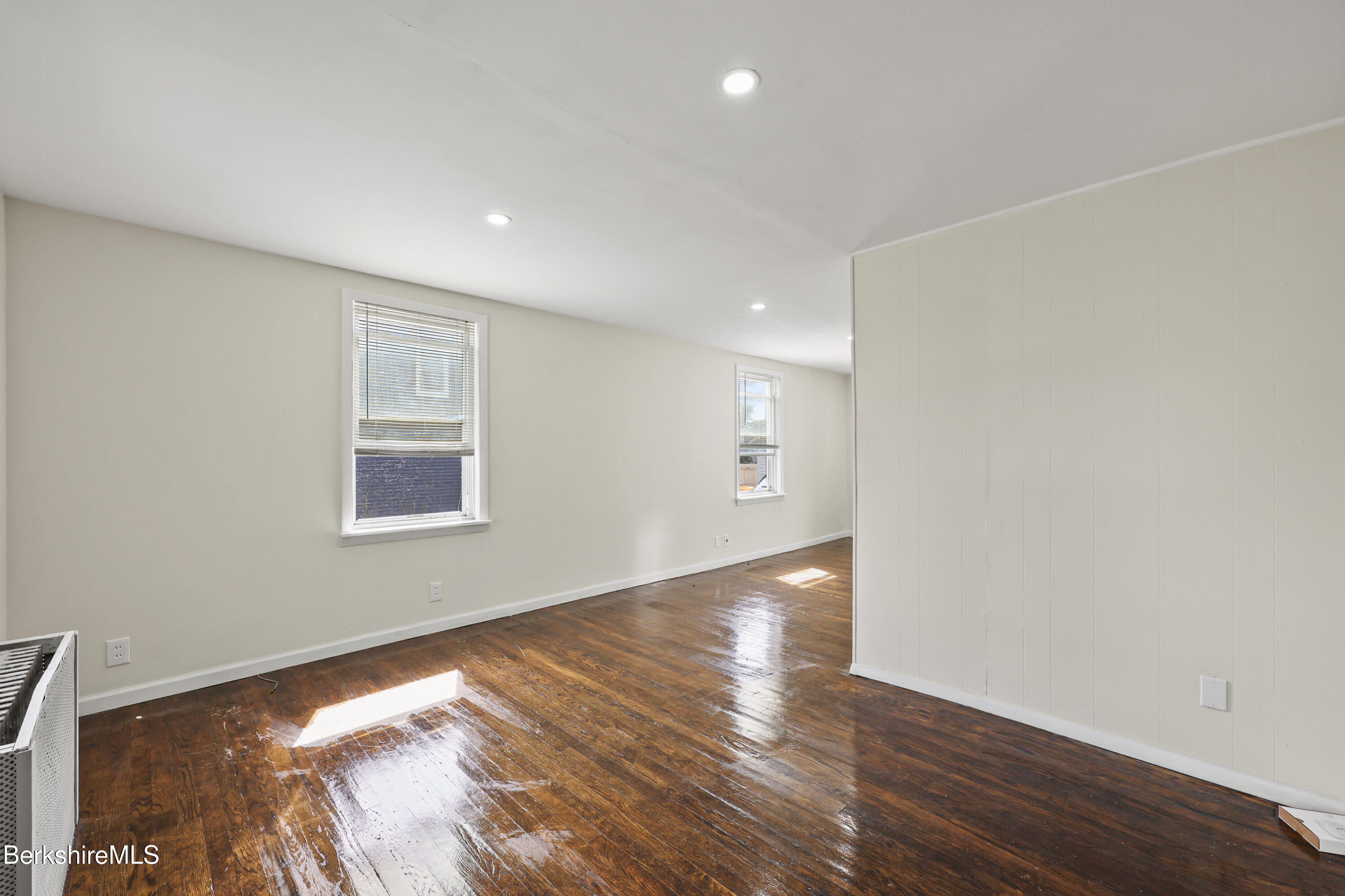 49 McArthur Street Pittsfield, MA 01201 - Photo 7 of 33 a view of an empty room with wooden floor and a window