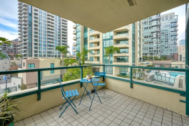 a view of a balcony with chairs