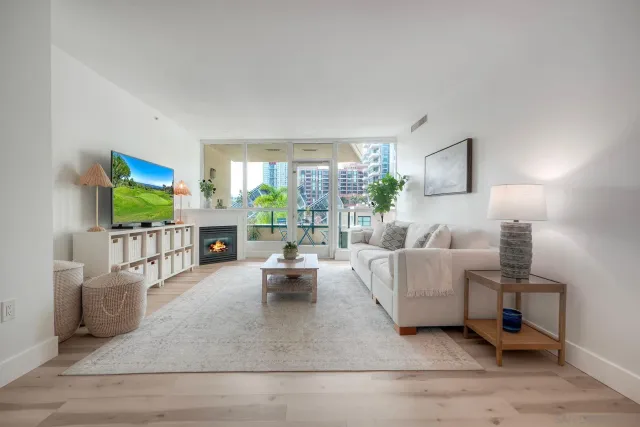 a living room with fireplace furniture and a flat screen tv