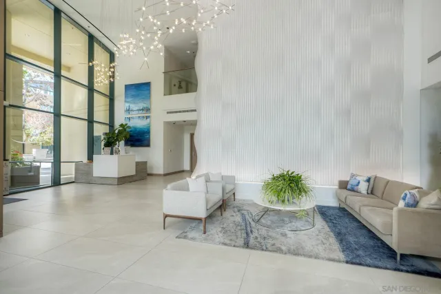 a room with pool table and windows