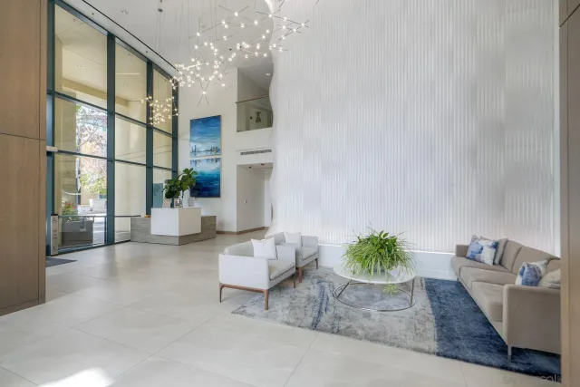 a living room with furniture and a potted plant