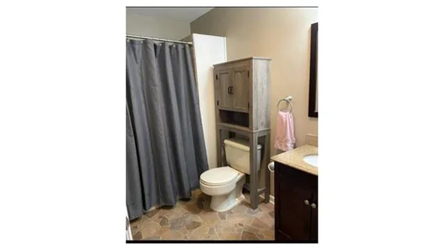 a bathroom with a toilet and a sink