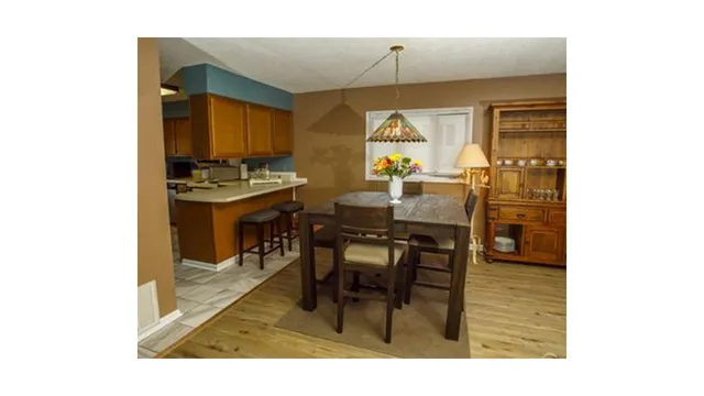 a view of a dining room with furniture and window
