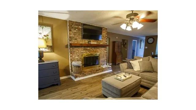 a living room with furniture and a fireplace