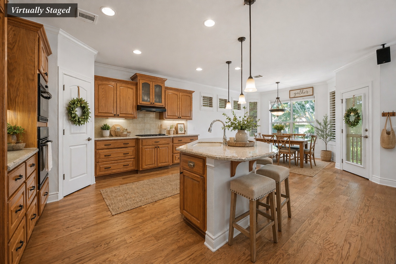 815 River Walk Trail Georgetown, TX 78633 - Photo 13 of 36 Take a seat at the wrap-around breakfast bar—the perfect spot for a quick lunch or catching up over coffee *Virtually staged image