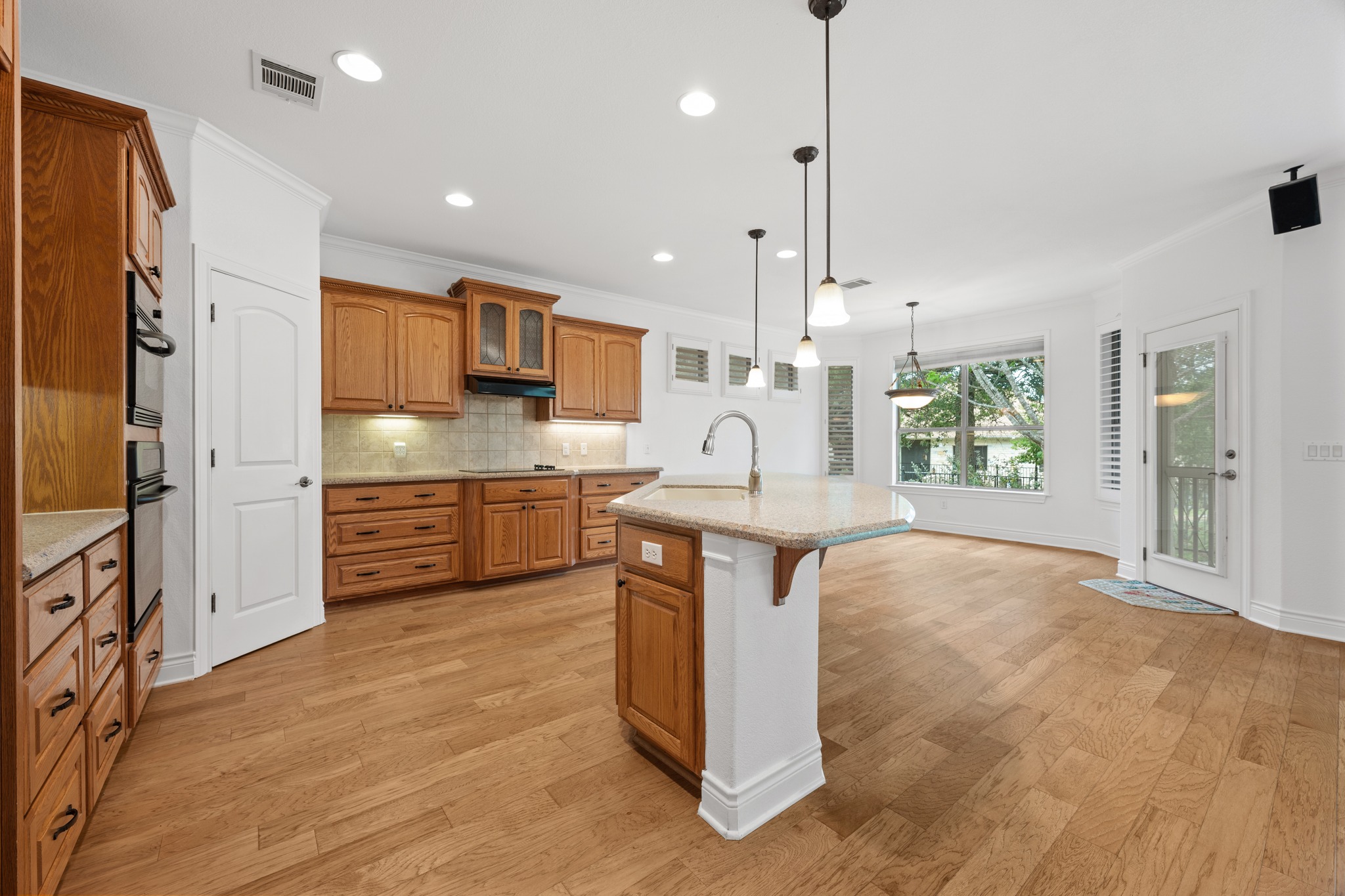 815 River Walk Trail Georgetown, TX 78633 - Photo 14 of 36 Looking out from the kitchen sink directly into the living and dining room, keeping the home feeling bright and communal