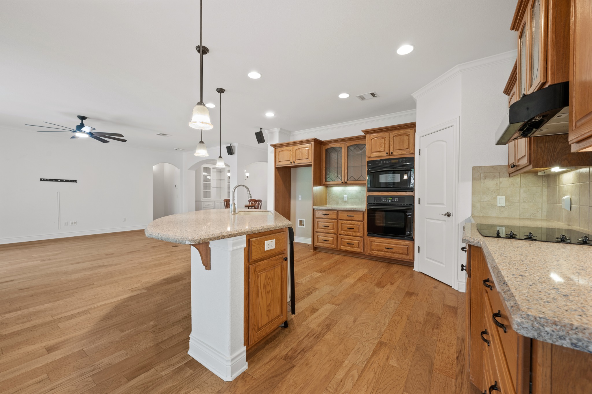 815 River Walk Trail Georgetown, TX 78633 - Photo 15 of 36 Equipped with an electric cooktop and a built-in oven, this space is as practical as it is inviting