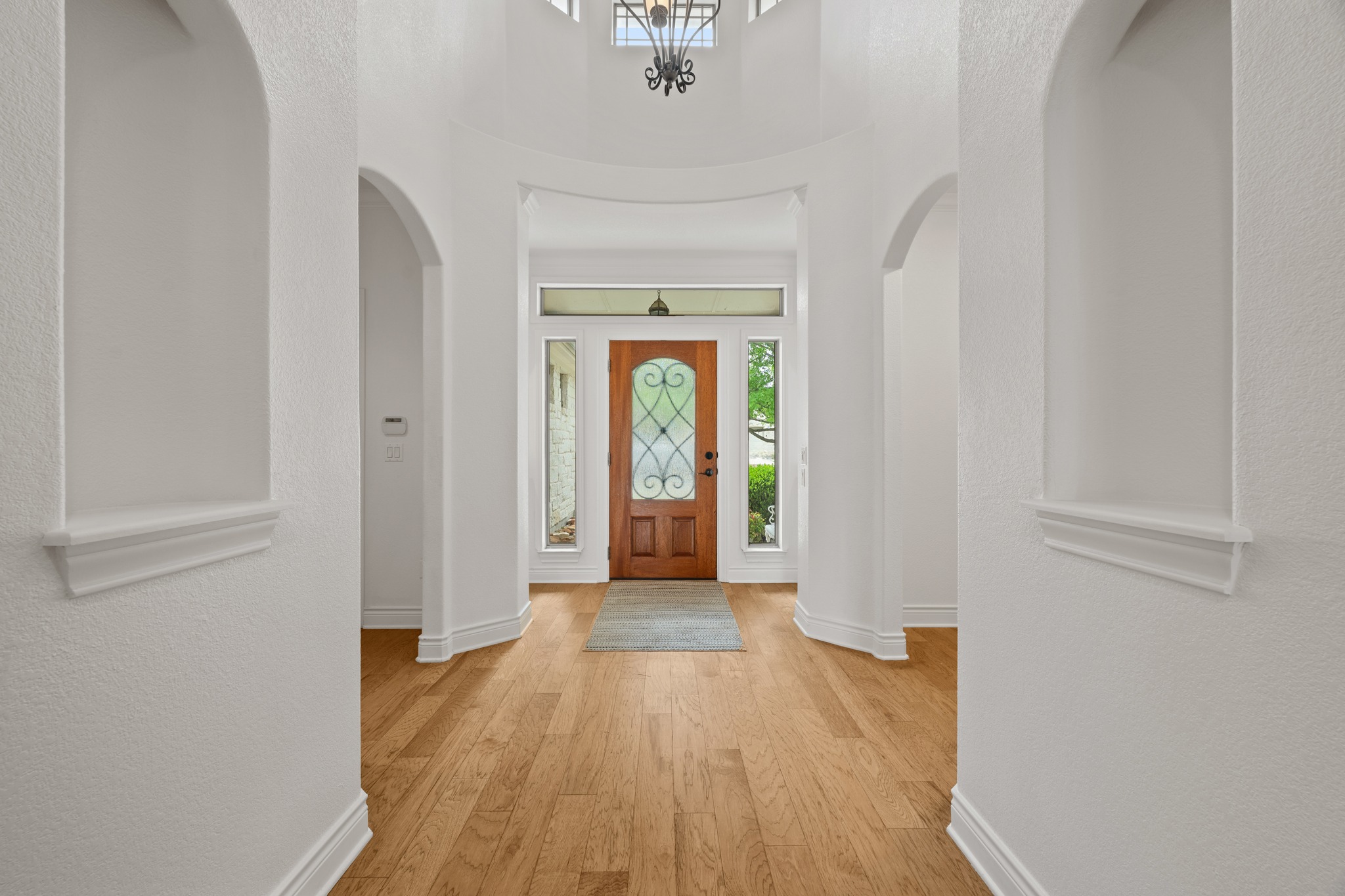 815 River Walk Trail Georgetown, TX 78633 - Photo 2 of 36 Step inside to a light and welcoming entry that immediately feels like home, offering a clear view through the heart of the house