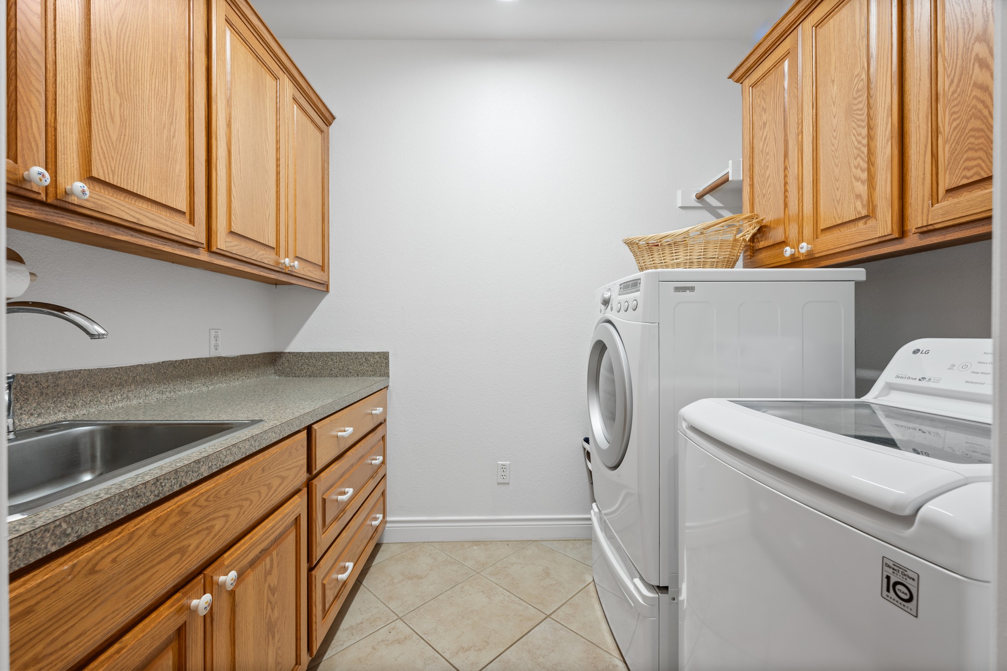 815 River Walk Trail Georgetown, TX 78633 - Photo 25 of 36 The dedicated laundry room includes a sink, making it easy to handle delicate items or cleanup after gardening. And don't miss of the cabinets!