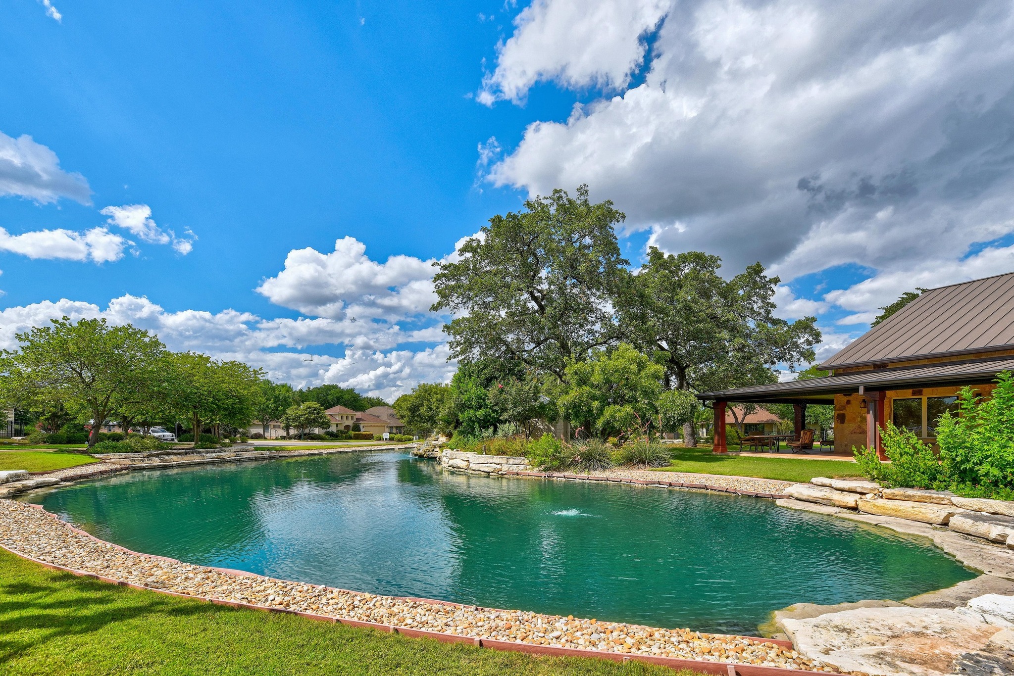 815 River Walk Trail Georgetown, TX 78633 - Photo 33 of 36 Take a stroll down to the community pond, a tranquil spot perfect for watching the local wildlife