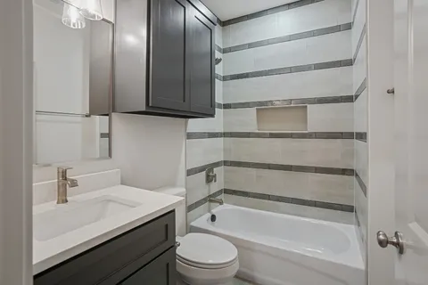 a room that has a bath tub and a sink