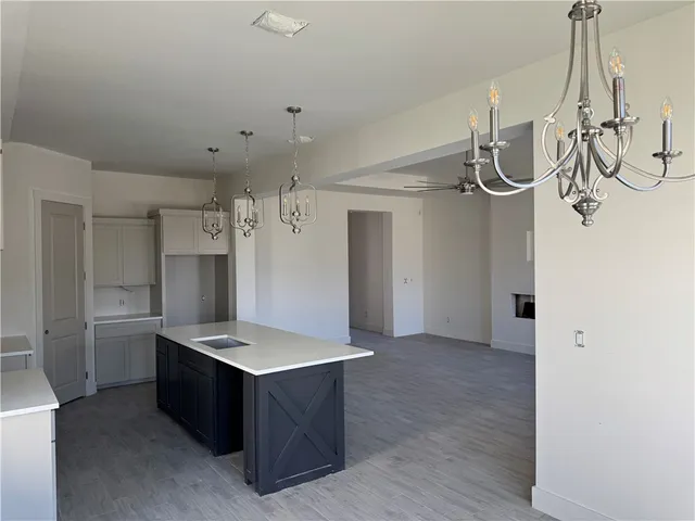 a large kitchen with cabinets and stainless steel appliances