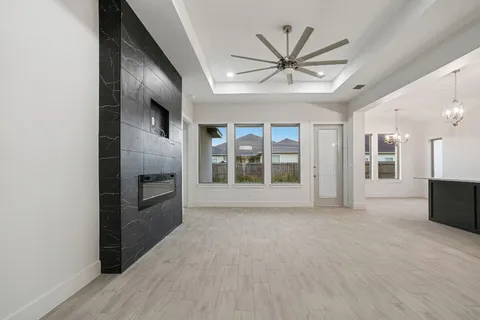 a view of livingroom with hardwood floor and ceiling fan