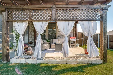 a outdoor living space with patio furniture and a potted plant