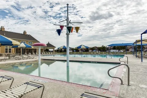 a view of living room filled with furniture and furniture