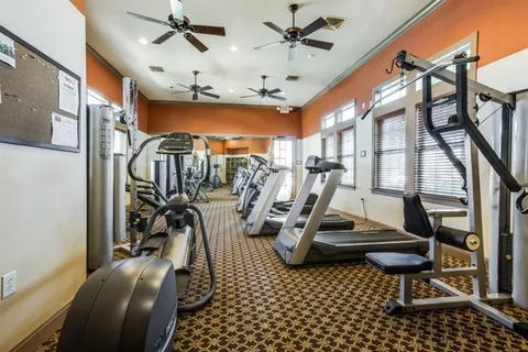 a view of a yard with large trees