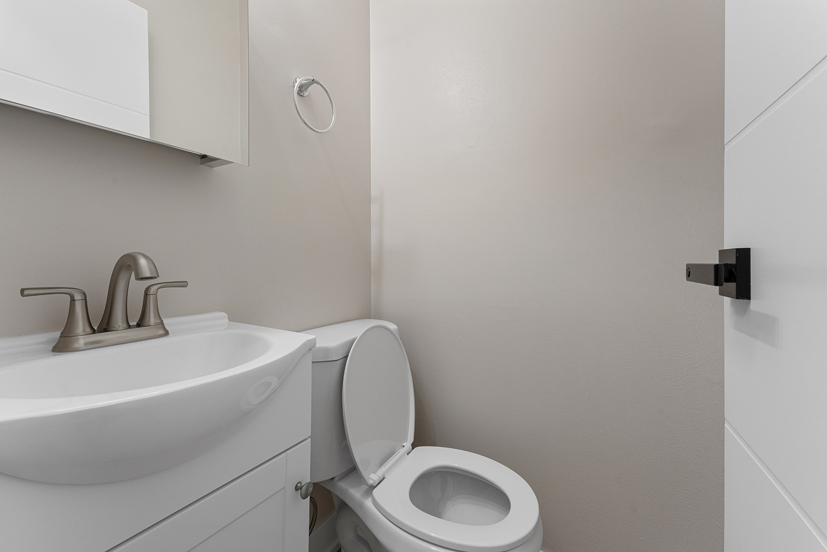 6166 North Sheridan Road, Unit 16A Chicago, IL 60660 - Photo 11 of 17 a bathroom with a toilet a sink and mirror