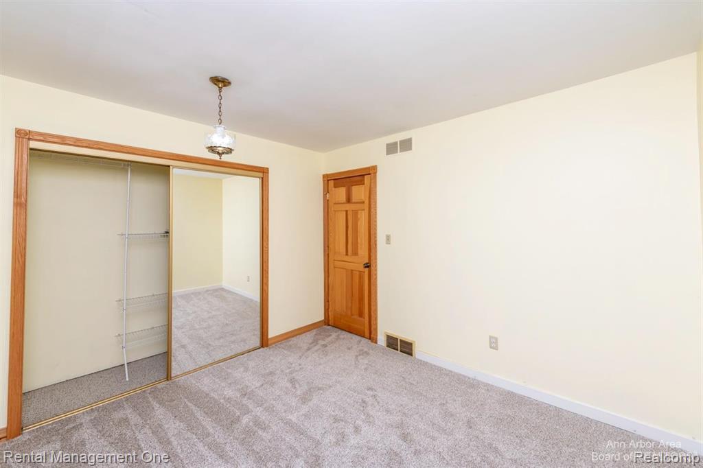 7870 Chamberlin Road Dexter, MI 48130 - Photo 32 of 52 Room featuring neutral carpeting and light-colored walls