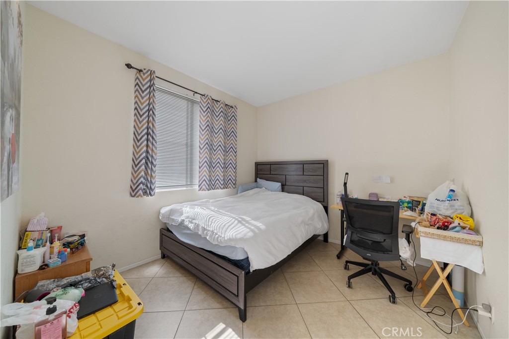 11159 St Tropez Drive Rancho Cucamonga, CA 91730 - Photo 13 of 40 a bedroom with a bed and a window