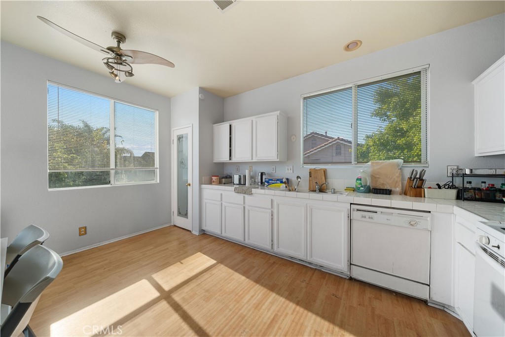 11159 St Tropez Drive Rancho Cucamonga, CA 91730 - Photo 21 of 40 a kitchen with a sink cabinets and window