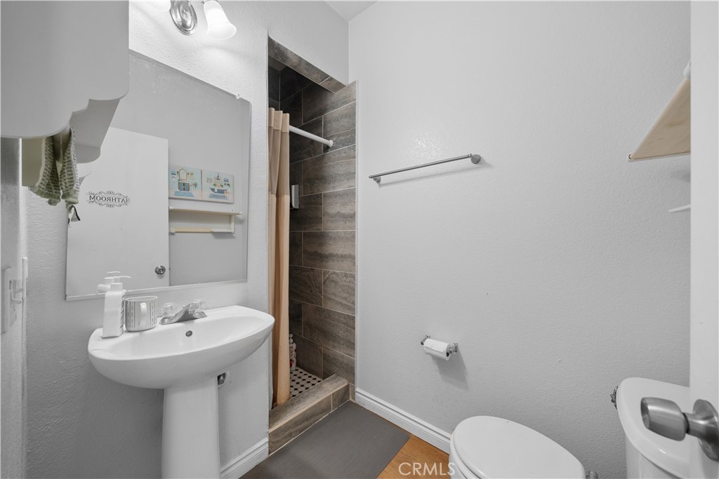 11159 St Tropez Drive Rancho Cucamonga, CA 91730 - Photo 28 of 40 a bathroom with a sink a toilet and shower