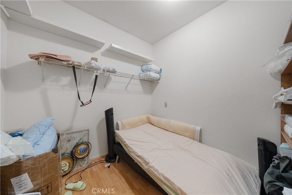 11159 St Tropez Drive Rancho Cucamonga, CA 91730 - Photo 33 of 40 a bedroom with a bed and a wooden floor