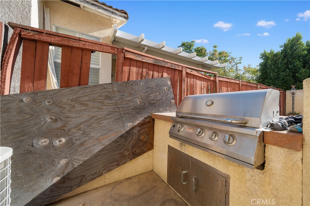 11159 St Tropez Drive Rancho Cucamonga, CA 91730 - Photo 34 of 40 a view of barbeque grill with granite counter top