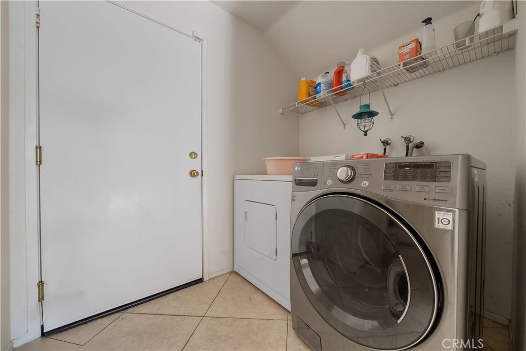 11159 St Tropez Drive Rancho Cucamonga, CA 91730 - Photo 6 of 40 a utility room with dryer and washer