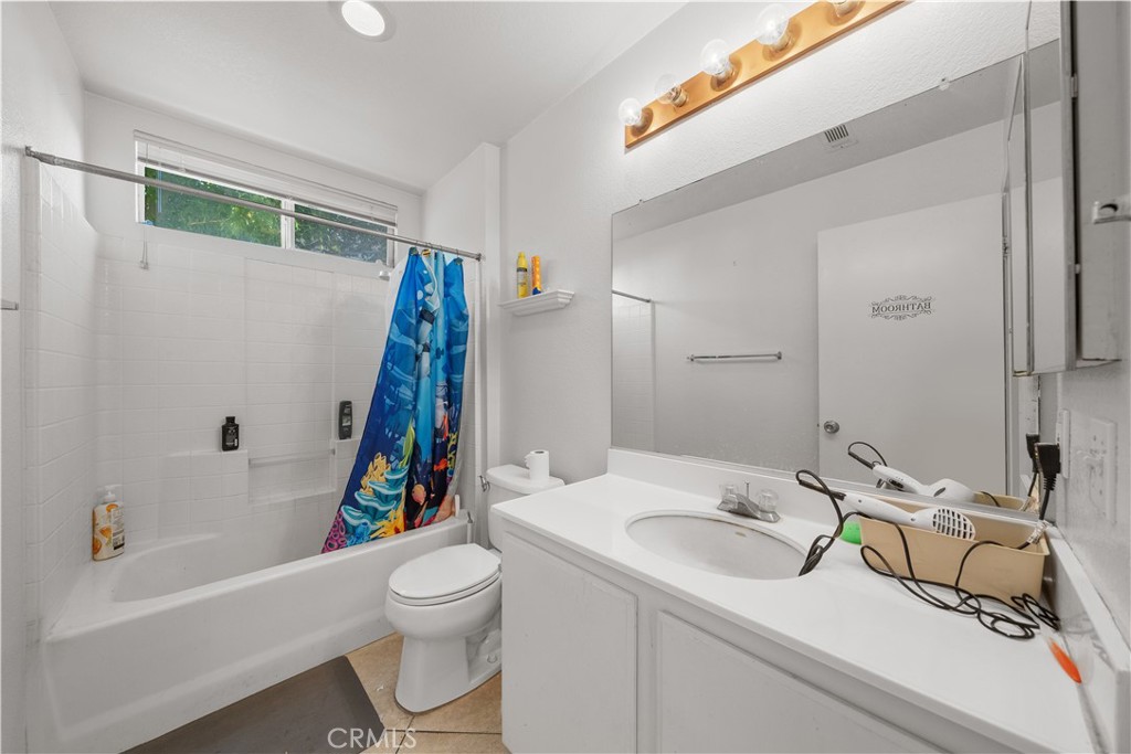 11159 St Tropez Drive Rancho Cucamonga, CA 91730 - Photo 7 of 40 a bathroom with a sink a toilet and a bathtub
