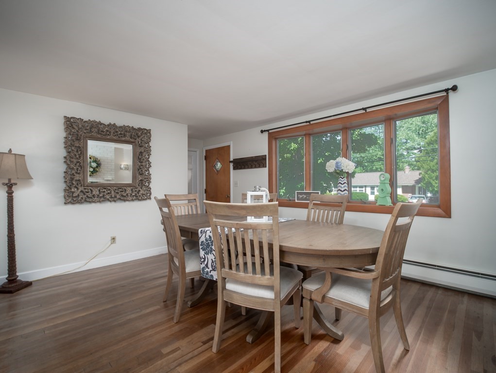28 Elmfield Road Framingham, MA 01701 - Photo 2 of 37 a view of a dining room with furniture window and wooden floor