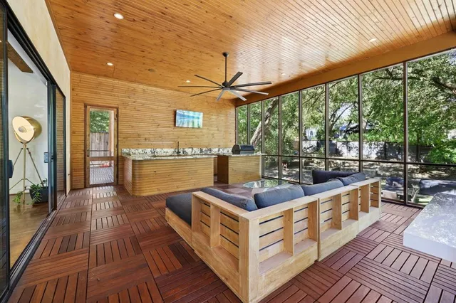 a bedroom with a bed and a dresser next to a window