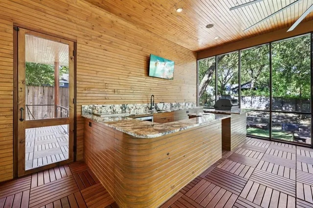 a bathroom with a double vanity sink toilet and shower