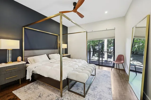 a bedroom with a bed and a mirror