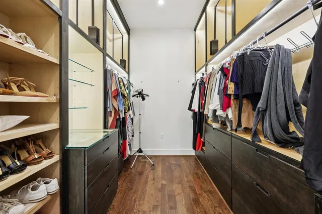 a bathroom with a sink a mirror a vanity and a shower