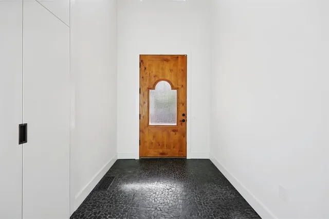 a kitchen with a stove and a refrigerator