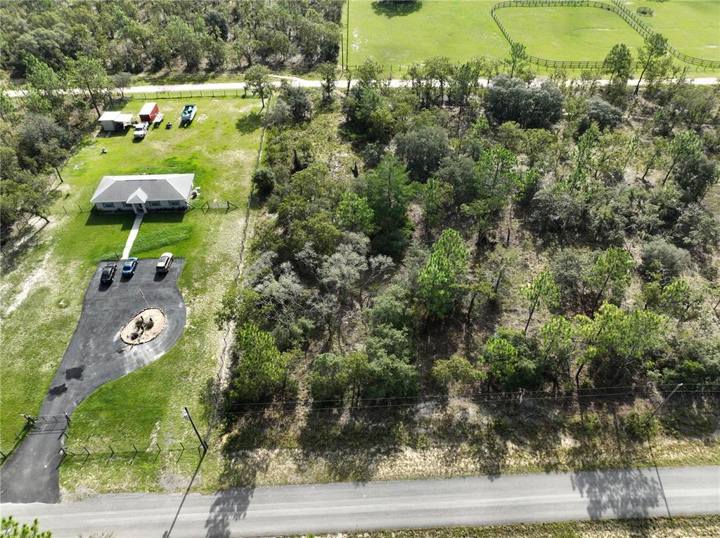 Tbd Southeast 129th Court Dunnellon, FL 34431 - Photo 11 of 25 an aerial view of a house with yard swimming pool and outdoor seating