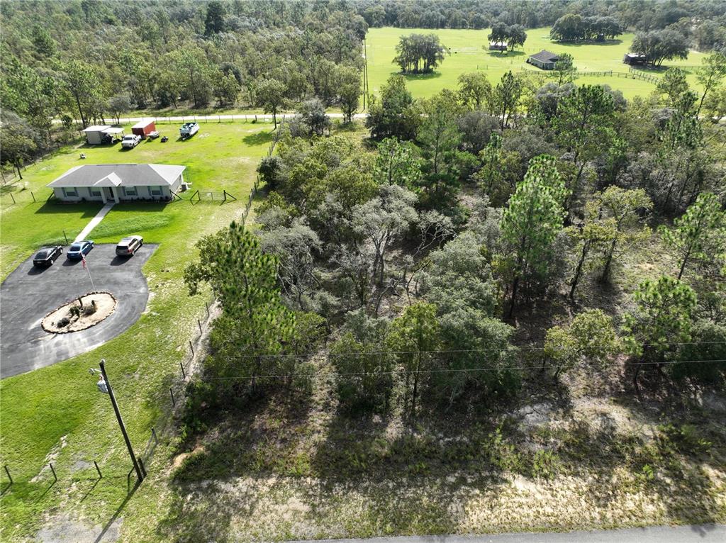 Tbd Southeast 129th Court Dunnellon, FL 34431 - Photo 5 of 25 a aerial view of a house with a yard basket ball court and outdoor seating