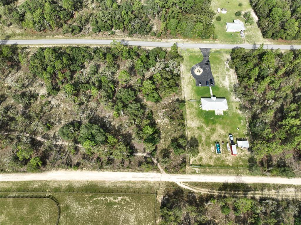 Tbd Southeast 129th Court Dunnellon, FL 34431 - Photo 7 of 25 a view of a yard with a house and a lake view