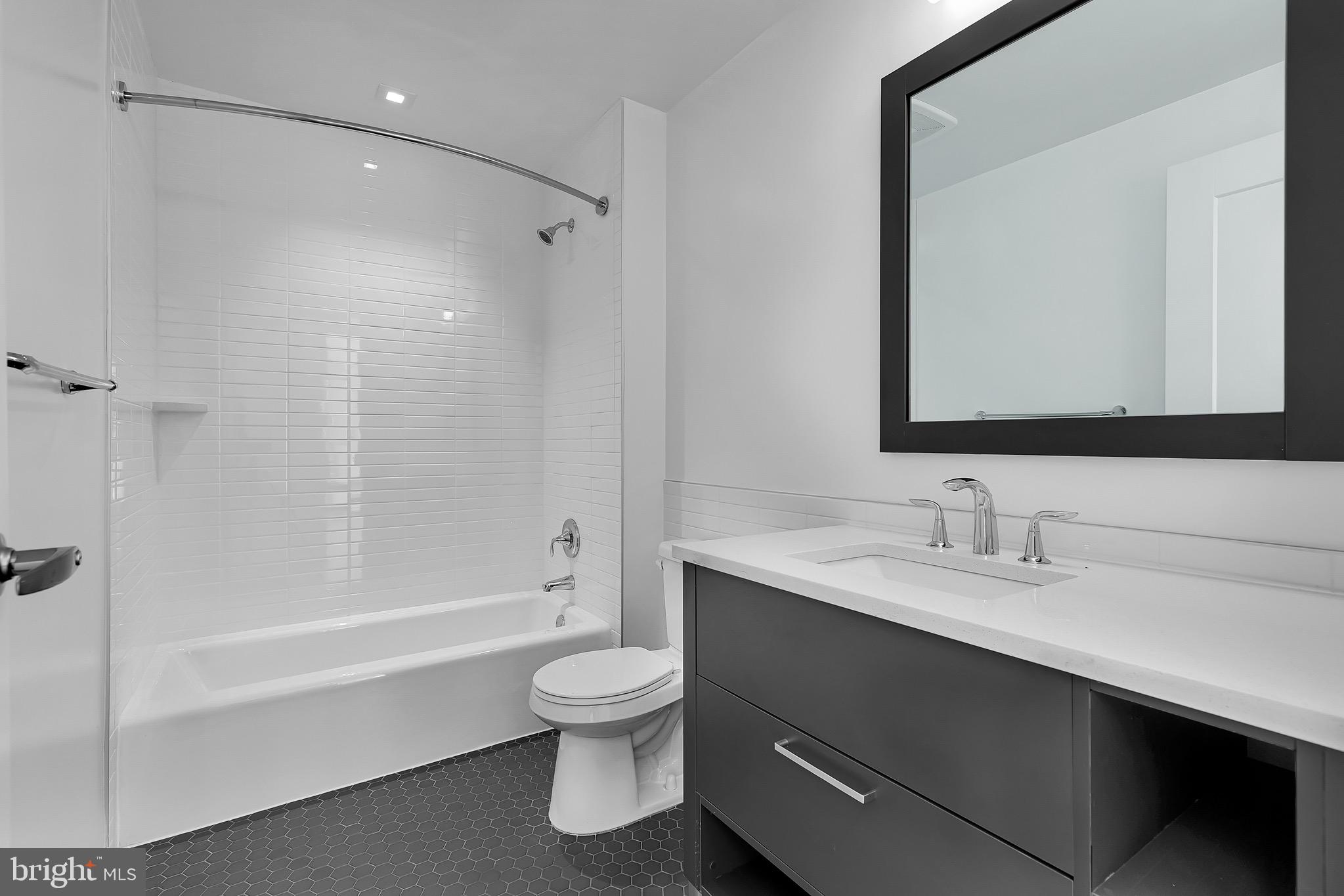 150 I Street Southeast, Unit 1 BR Washington, DC 20003 - Photo 11 of 26 a bathroom with a sink a toilet and shower