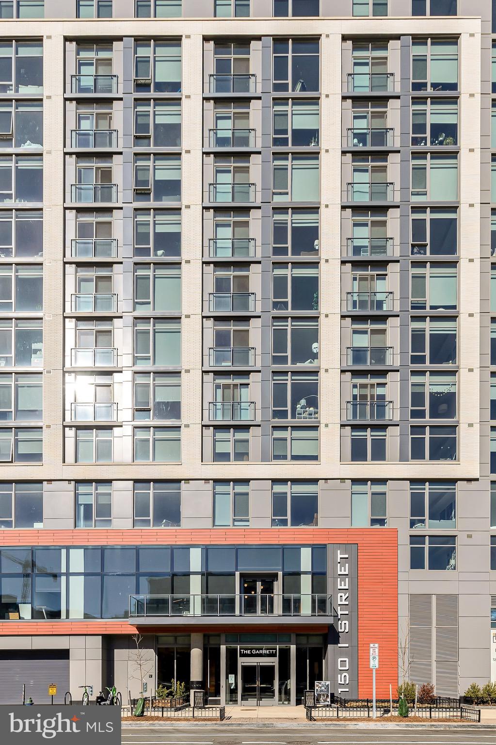 150 I Street Southeast, Unit 1 BR Washington, DC 20003 - Photo 2 of 26 a building with a lot of windows
