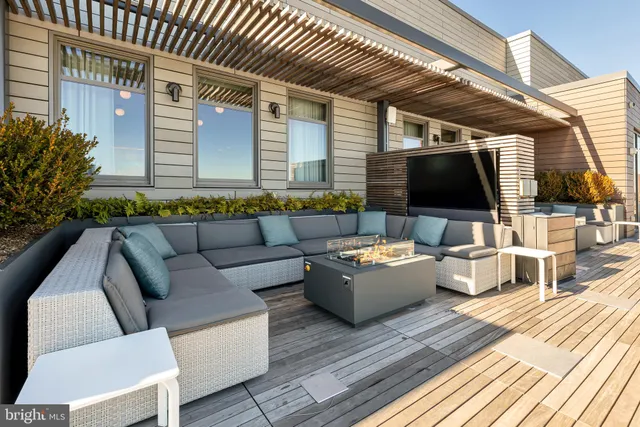 a view of a swimming pool and an outdoor seating