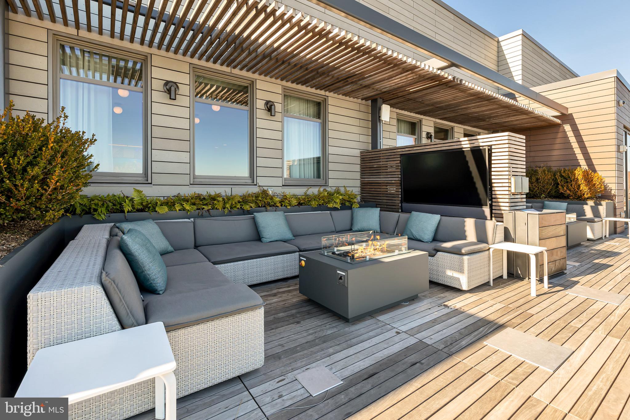 150 I Street Southeast, Unit 1 BR Washington, DC 20003 - Photo 25 of 26 a outdoor living space with patio furniture and a flat screen tv
