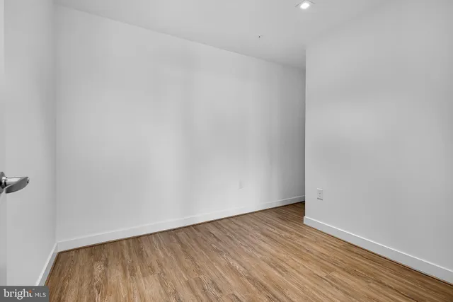 a view of a room that has a large window