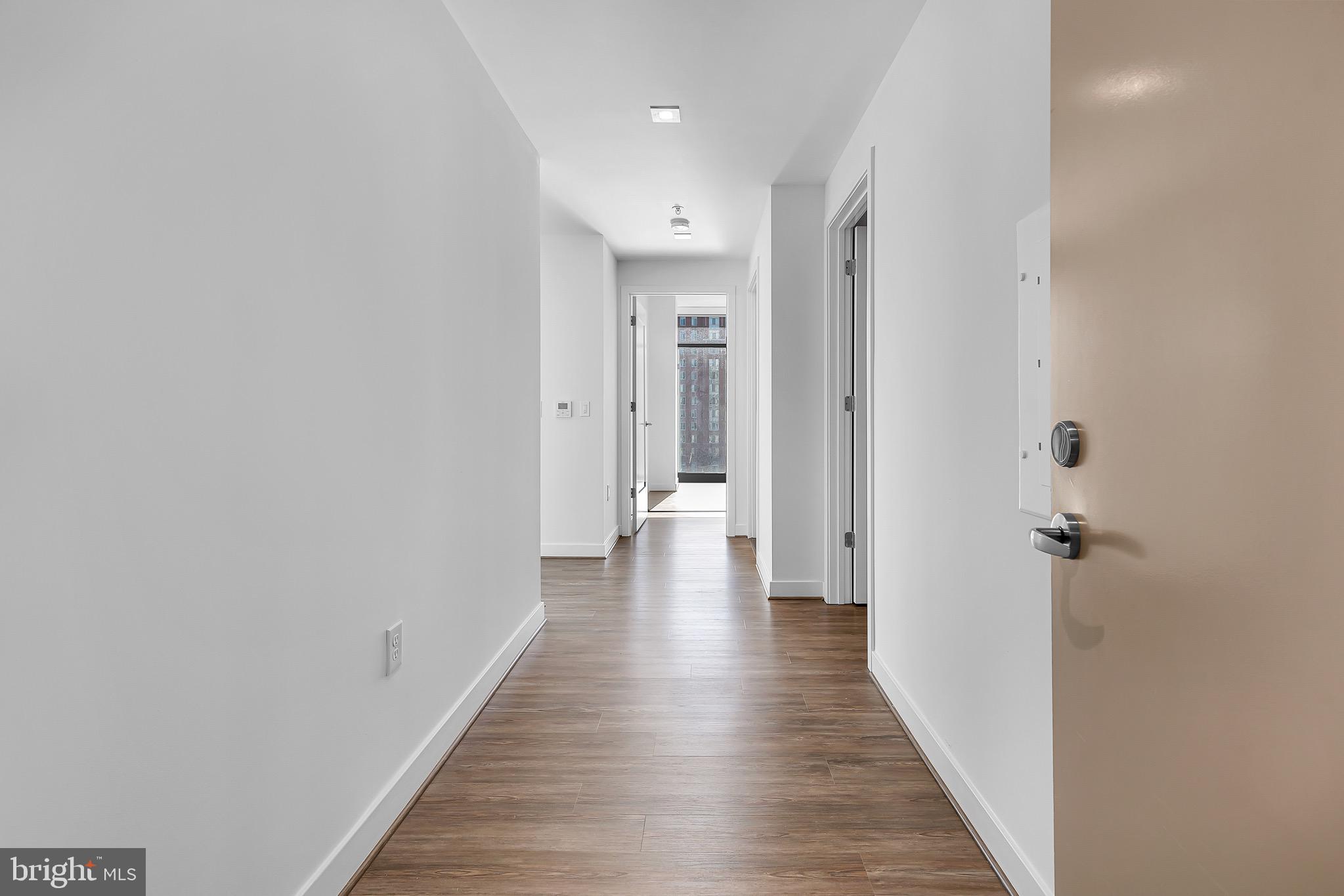 150 I Street Southeast, Unit 1 BR Washington, DC 20003 - Photo 9 of 26 a view of a hallway with wooden floor
