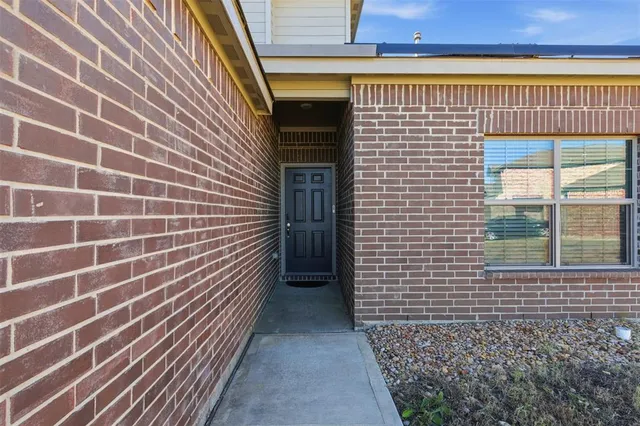 a view of a brick house with a door
