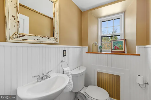 a living room with furniture a window and a rug